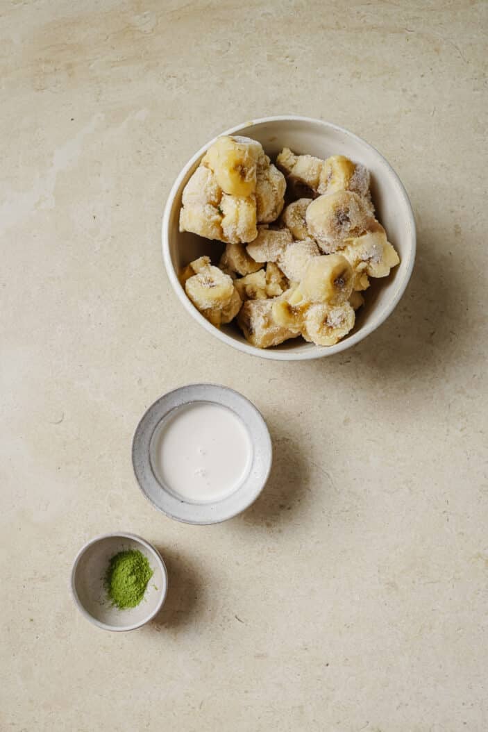 all of the ingredients required for making matcha nice cream separate in individual bowls