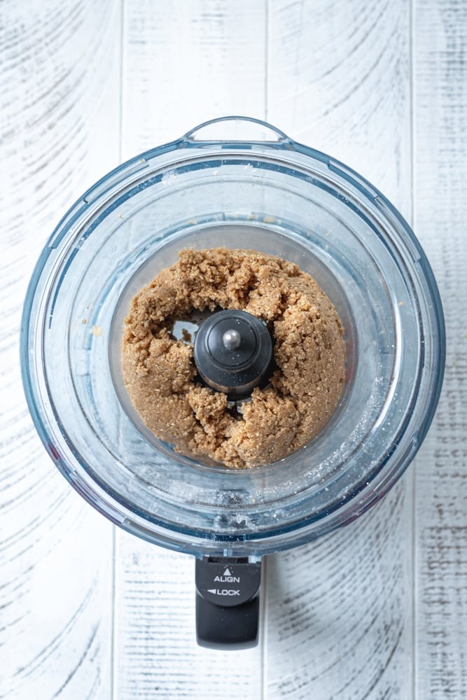 matcha cheesecake crust ingredients pulsed together to make a dough