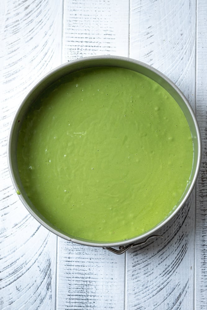 matcha cheesecake with the filling that's ready to be chilled