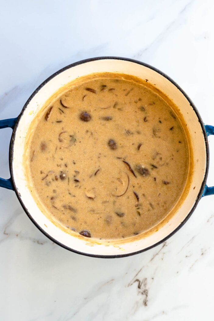 Toss in the thyme and bay leaf and pour in the remaining broth. Simmer the soup for 10 minutes, or until the mushrooms are perfectly soft and cooked through. 