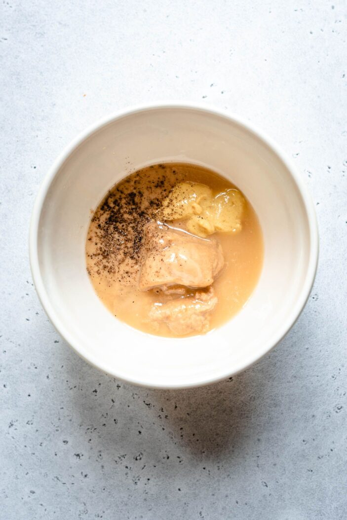 tahini dijon lemon juice and pepper in a small bowl