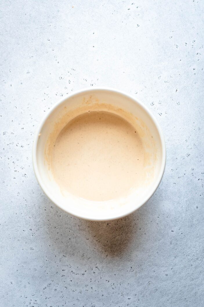 vegan caesar dressing in a white bowl