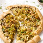 potato leek galette with a slice cut out of it