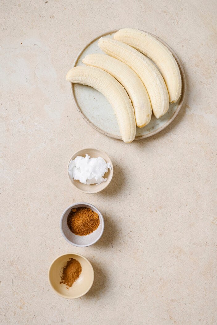 All of the ingredients required to make these caramelized bananas separated into individual bowls.