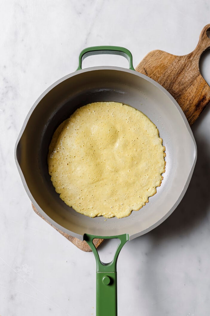 cooked tofu omelette in a skillet