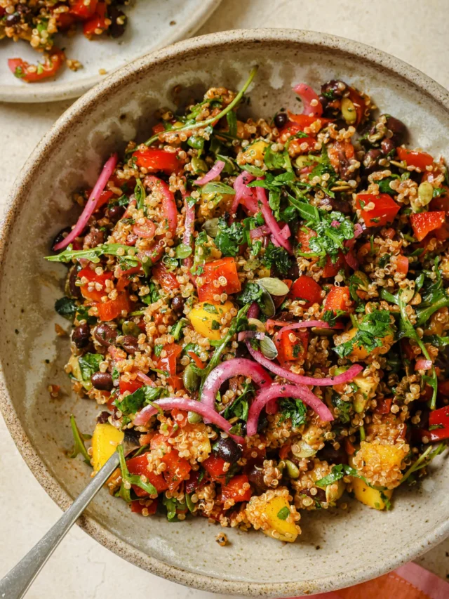 30-Minute Black Bean Quinoa Salad.🧡🌱 Made with mango, avocado, tomatoes, arugula and a cilantro lime dressing. Comment “SALAD” below and I’ll DM you the recipe. I made this last weekend and we were freaking! It’s a crunchy, tangy, and wholesome dinner salad. 

#plantbasedrecipe #healthysalad #blackbeans #quinoasalad #salads